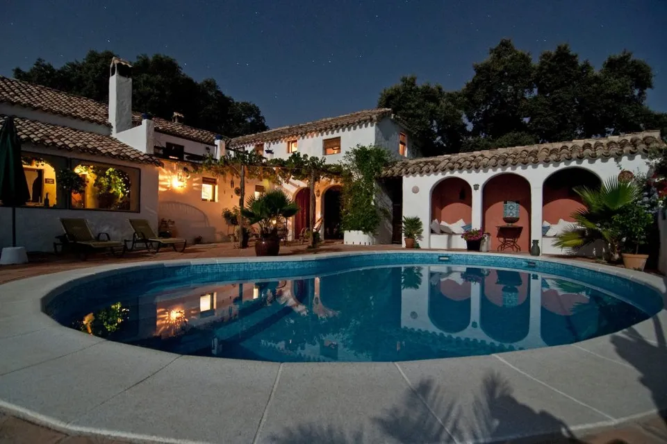 A villa and pool in a tropical setting