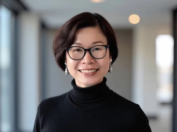 Jackie Wu in a black top and glasses